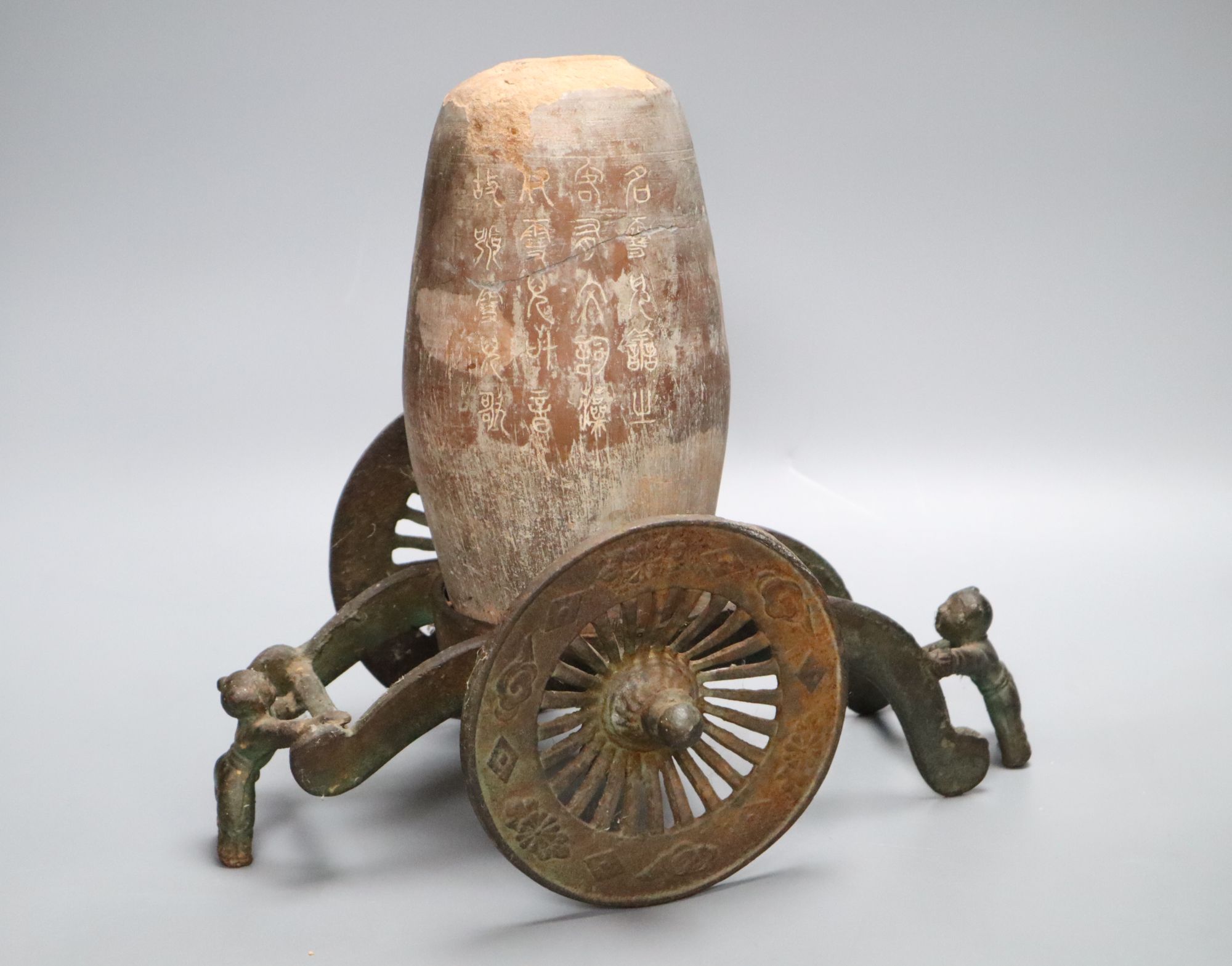 A Chinese pottery vase, with an iron carriage base, Han dynasty or later, height overall 28cm